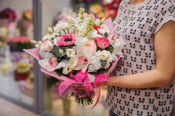 Rich bunch of white and pink flowers in hands