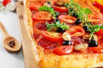 Rectangle delicious pizza on the table, close-up