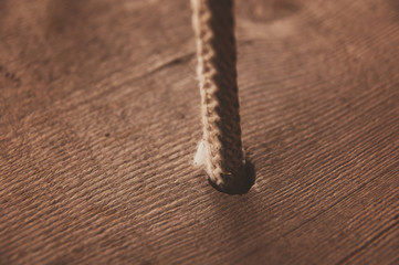 Wooden swing hanging on couple of ropes
