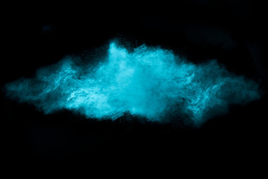 Blue Dust Particle Explosion Isolated on Black