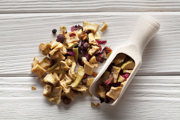 Dried fruit tea and wooden scoop