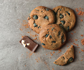 Chocolate chip cookies on dark grey background, top view