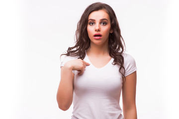 young woman in blank white t-shirt missunderstand pointing finger on herself