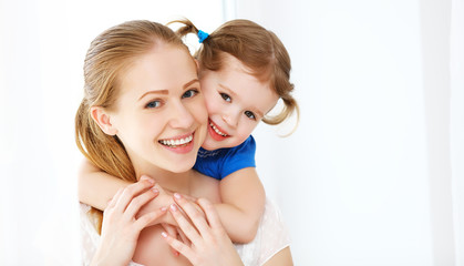 Happy loving family. mother and child laughing and hugging