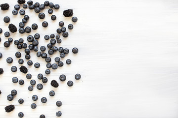 Berries on Wooden Background flat lay.
