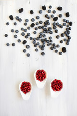 Berries on Wooden Background flat lay.