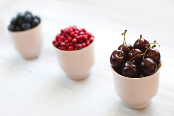 Berries on Wooden Background.