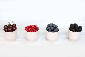 Berries on Wooden Background.