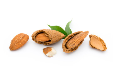 Almonds with leaves isolated on white background