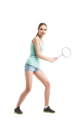 beautiful girl playing with badminton racket 