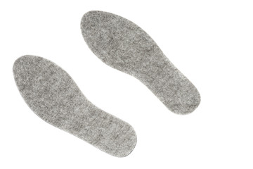 Pair of felt insoles isolated