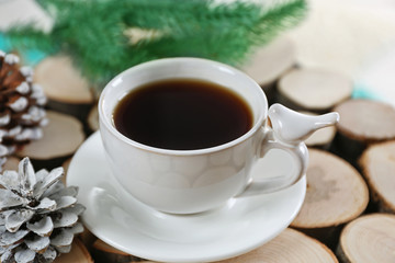 Beautiful winter composition with cup of hot drink