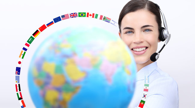 Customer service operator woman with headset ,globe and flags