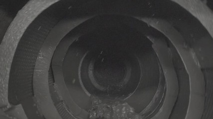 ore mixed with water spinning inside a ball mill in copper processing industry