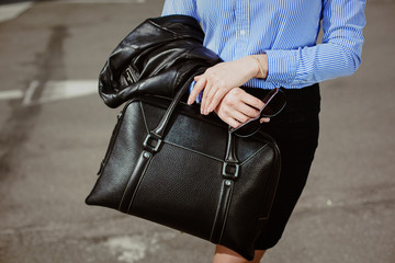Business style clothing. black bag and stilish sunglasses,  clos