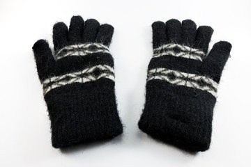 Black wool gloves isolated on white background