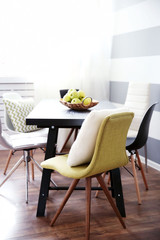 Modern room interior with table and chairs