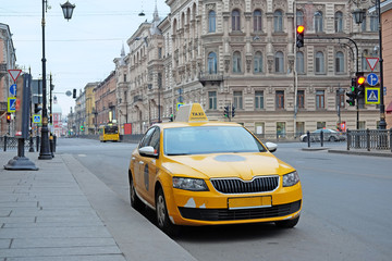 Fototapeta na wymiar St. Petersburg, Russia - March, 13, 2016: Taxi on the parking in St. Petersburg, Russia.