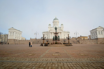 HELSINKI, FINLAND - april, 4, 2016: St. Nicholas Church and a monument of Alexander II on the Senatorial area in Helsinki, Finland.