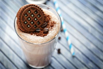 Delicious milk shake cocktail on wooden table, close up