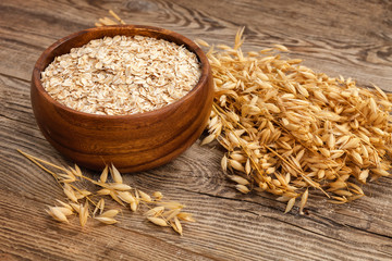 oatmeal and oat ears on the old board