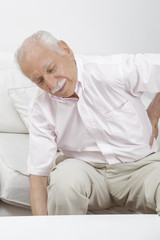 Obraz na płótnie Canvas Elderly man with back pain