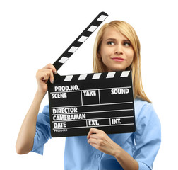Young attractive woman holding film clapper isolated on white