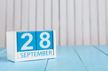 September 28th. Image of september 28 wooden color calendar on white background. Autumn day. Empty space for text