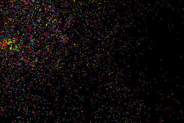 Abstract black background with falling confetti. Many round random tiny glitter pieces.