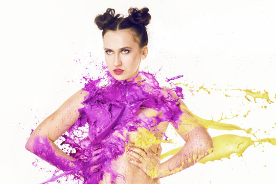 Color spash! A woman dressed in violet and yellow paint