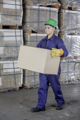Workers In Warehouse Preparing Goods For shipping