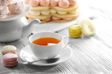 Cup of tea with delicious cakes