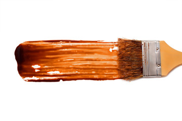 paint brush and dab of chocolate sauce. chocolate sauce. texture. sample and brush isolated on...