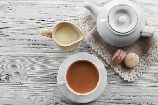Milk tea with tea pot on white background.