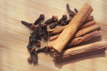spice cinnamon clove on a wooden board and blurred background