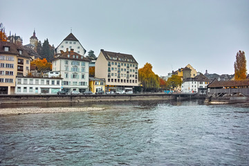 Fototapeta na wymiar City of Luzern and reflection of old town in The Reuss River, Switzerland