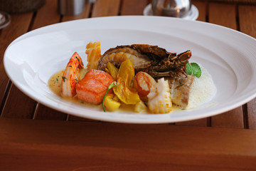 Seafood dish on a wooden table, close up