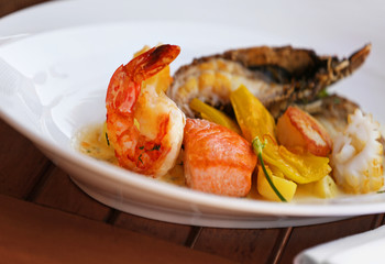 Seafood dish on a wooden table.
