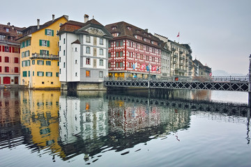 City of Luzern and reflection of old town in The Reuss River, Switzerland