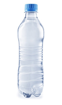 Bottled water on the grey background, close up