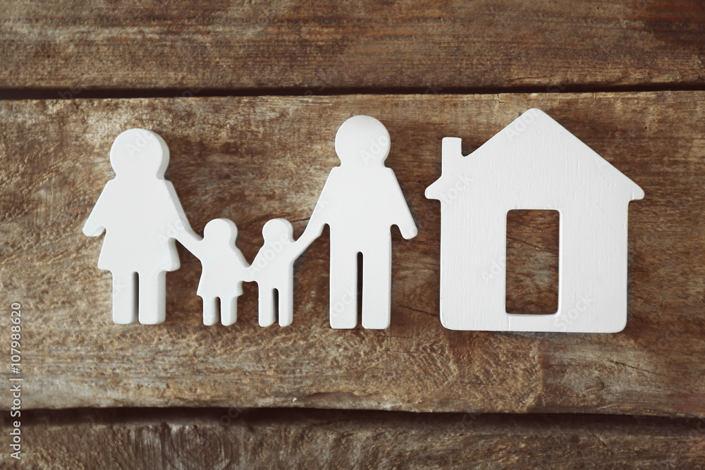 Poster Family figure with a house on wooden  background