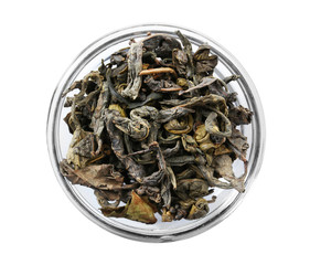 Dry tea in saucer isolated on white