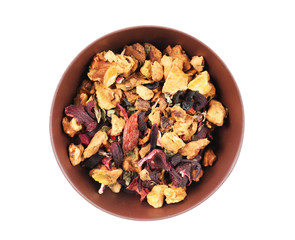 Dry tea in saucer isolated on white