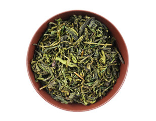 Dry tea in saucer isolated on white