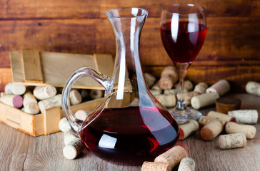 Glass of wine, decanter and wine corcs. Wine concept