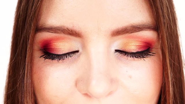 Woman face colorful eye makeup closed eyes closeup 4K
