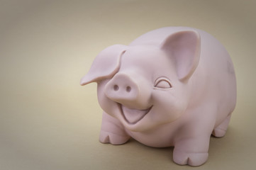 Kids Pink Piggy Bank Looking Forward, Isolated on brown Backgrou
