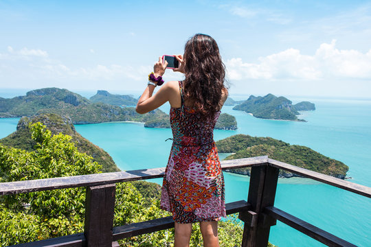 Young women standing at top on of mountain Angthong Islands