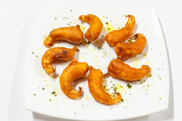 cooked shrimps served on white plate
