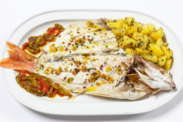 cooked fish served on white plate